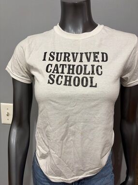 Graphic Tee "I Survived Catholic School" in White and Black